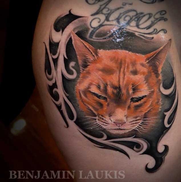 Beautiful colored big sad cat portrait tattoo