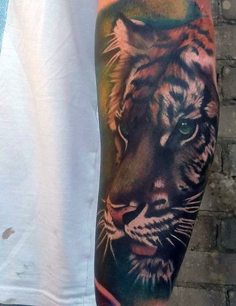 Beautiful colored forearm tattoo of tiger head