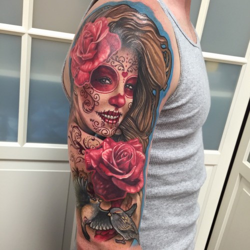 Beautiful colored shoulder tattoo of Mexican like woman portrait with flowers