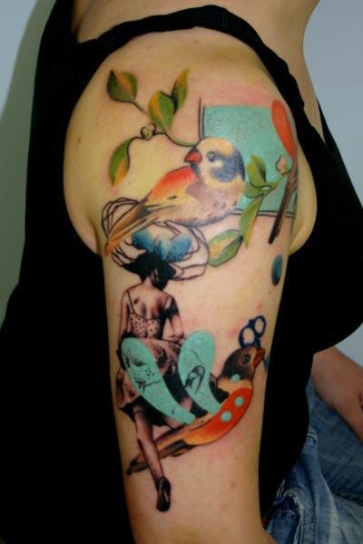 Beautiful colored shoulder tattoo of woman face with birds