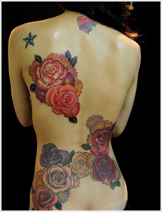 Beautiful colored various flowers tattoo on back