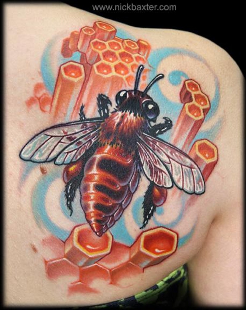 Beautiful colorful 3D like colored beet tattoo on shoulder with honeycombs