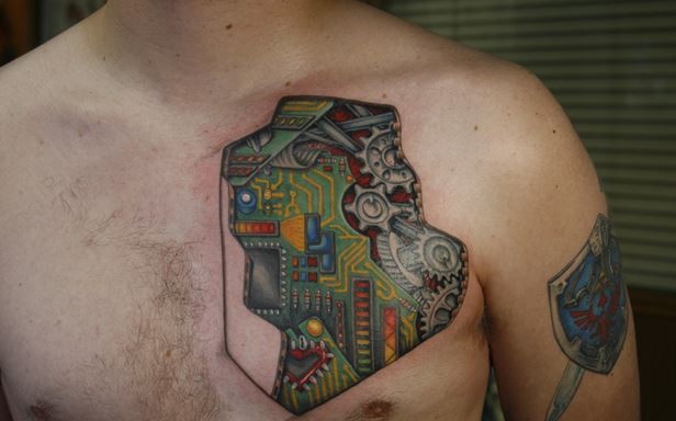 Beautiful colorful electronic circuit tattoo on chest