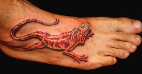 Beautiful colorful lizard tattoo on foot