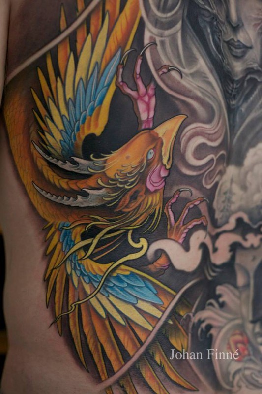 Beautiful colorful phoenix tattoo by Johan Finne