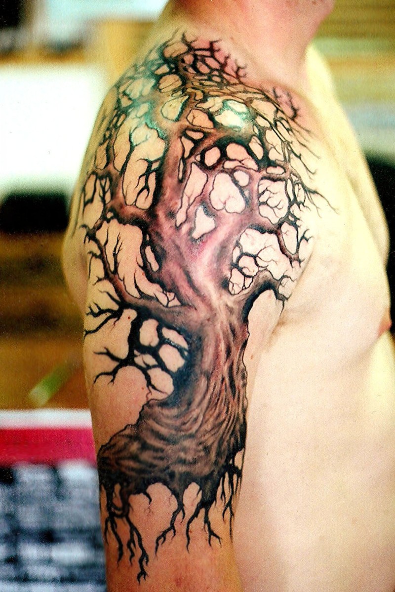 Beautiful colorful tree tattoo on shoulder