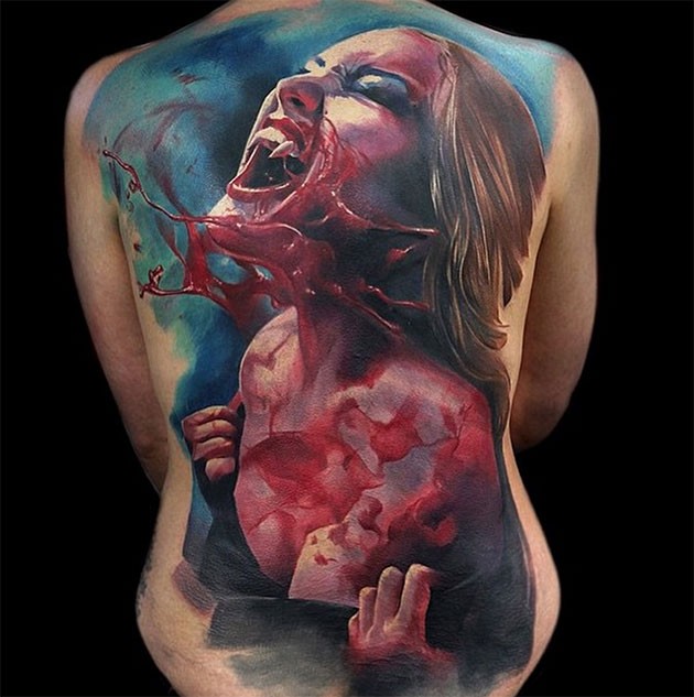 Beautiful colorful vampire horror tattoo on back