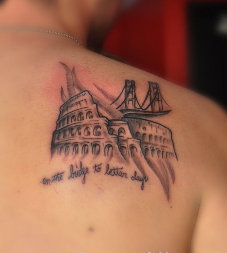 Beautiful colosseum in italy tattoo on shoulder blade