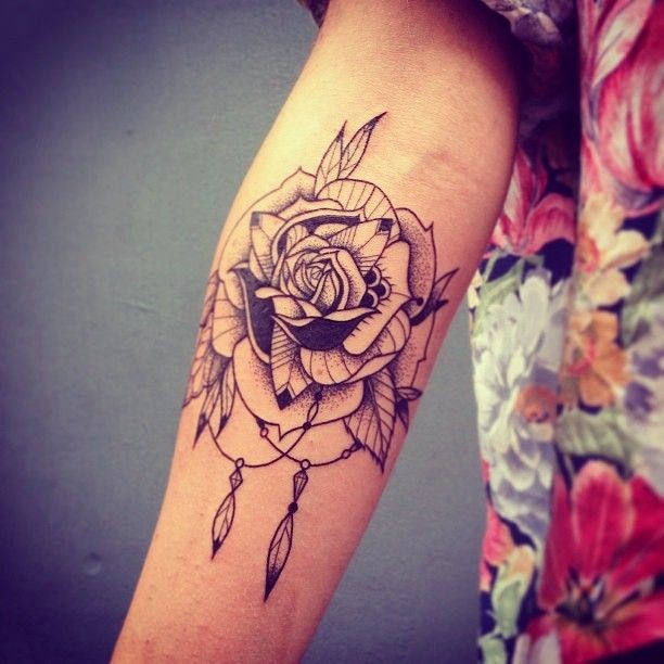 Beautiful girly black-contour tribal rose flower tattoo on forearm