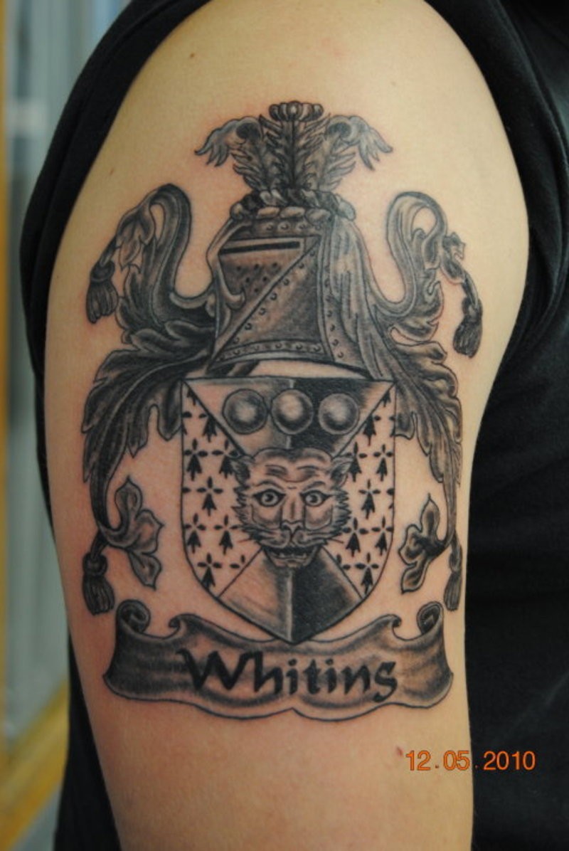 Beautiful gray ink family crest tattoo on half sleeve