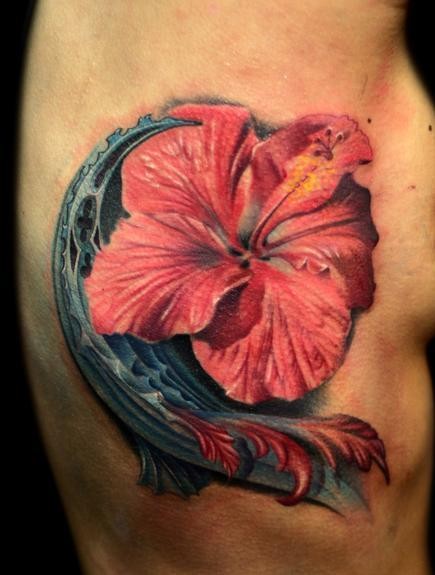 Beautiful hibiscus flower tattoo on ribs