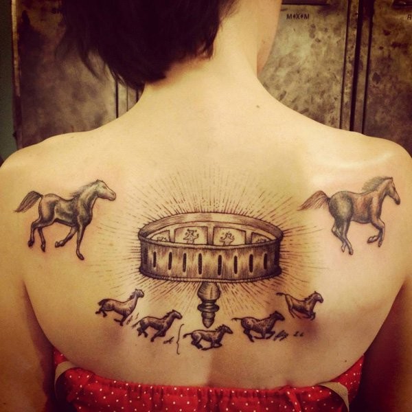 Beautiful horse themed colored tattoo on back