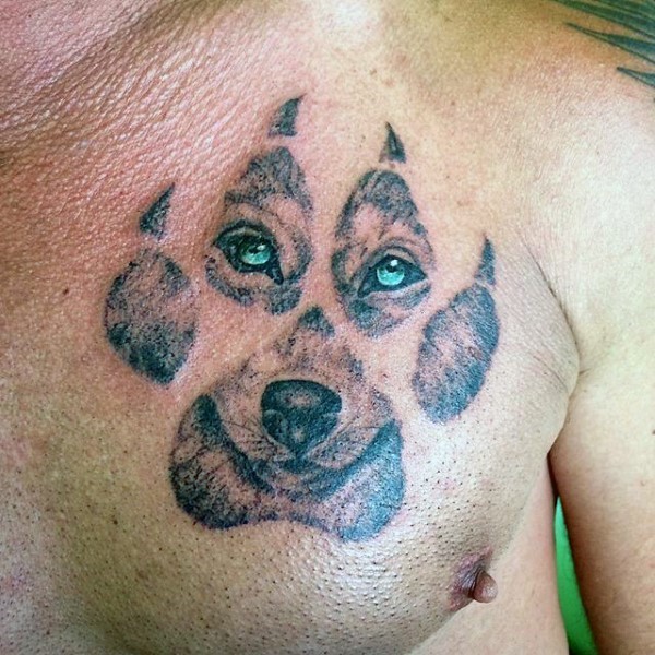 Beautiful illustrative style chest tattoo of wolf paw print stylized with cute wolf face