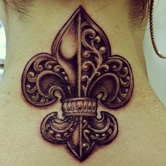 Beautiful iron fleur de lis tattoo on neck
