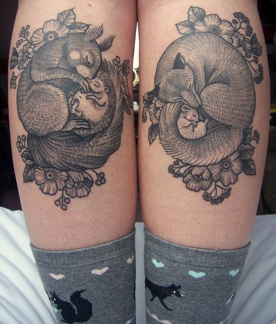 Beautiful looking black ink natural sleeping animals tattoo on leg muscles