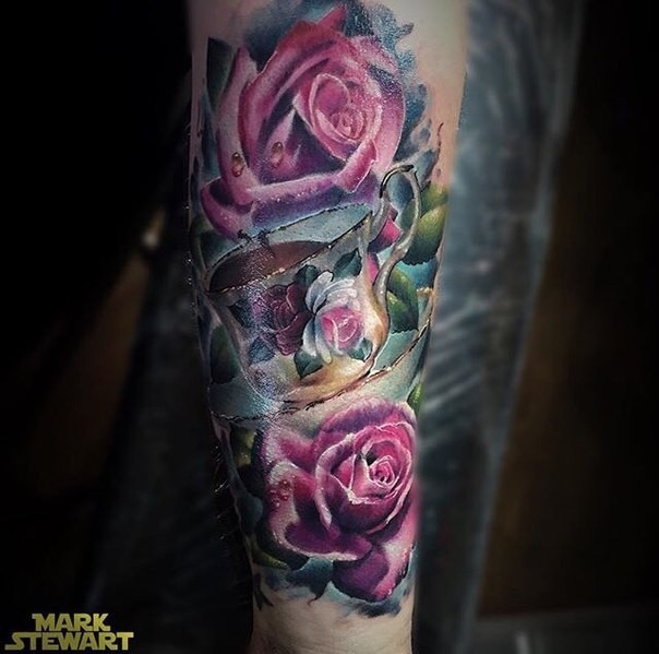 Beautiful looking colored arm tattoo of beautiful roses and tea cup