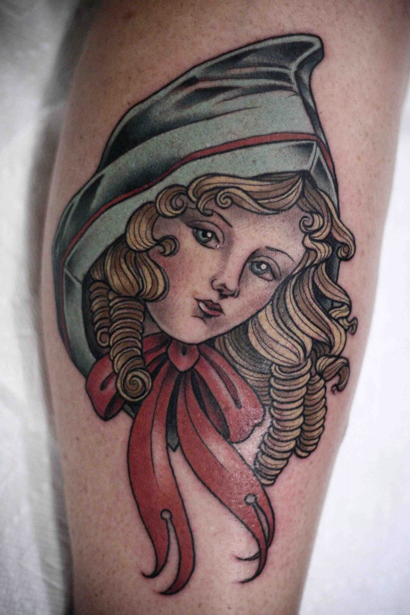 Beautiful looking colored leg tattoo of doll