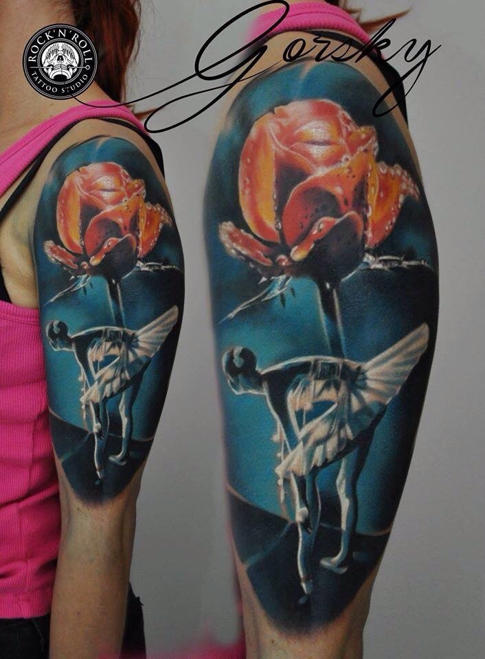 Beautiful looking colored shoulder tattoo of red flower and ballet dancer