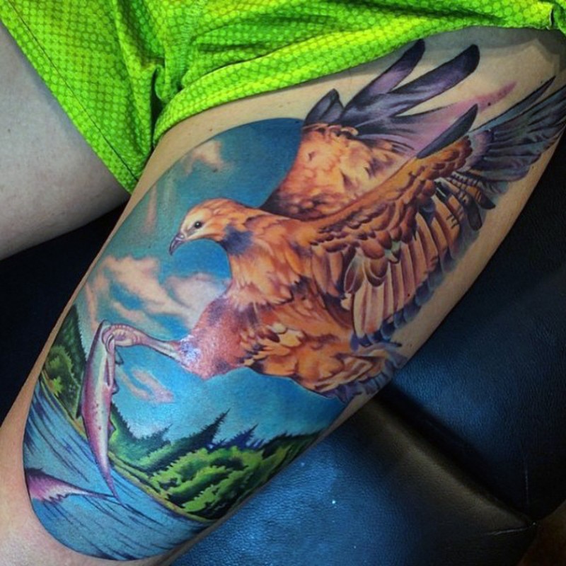 Beautiful looking colored thigh tattoo of eagle with fish