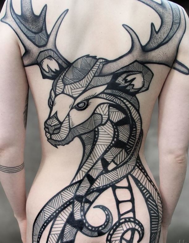 Beautiful looking detailed whole back tattoo of big deer with various ornaments