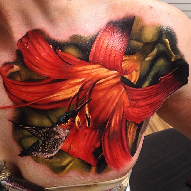 Beautiful looking realism style chest tattoo of large flower with bird