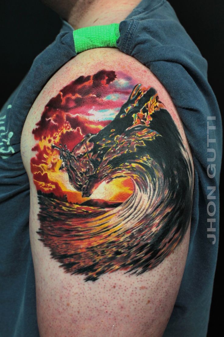 Beautiful natural looking colored shoulder tattoo of big ocean wave