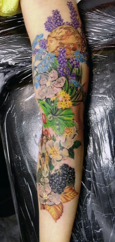 Beautiful natural looking forearm tattoo with flowers