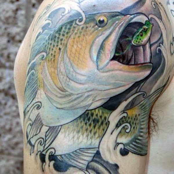 Beautiful painted and colored big fish chasing the lure tattoo on arm top