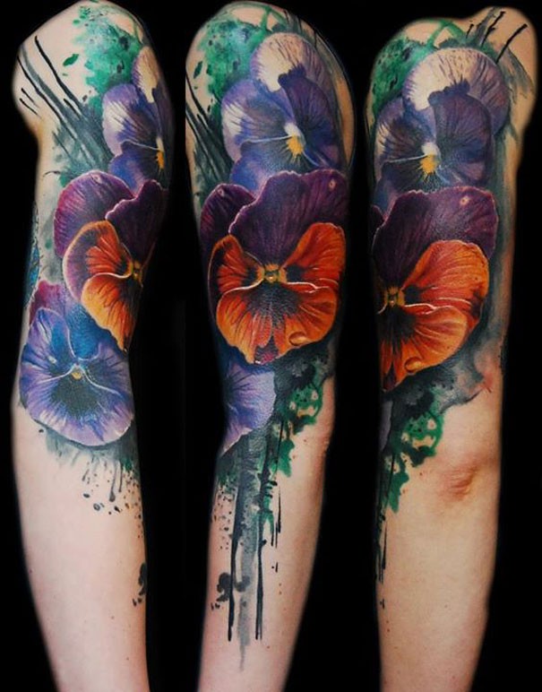 Beautiful painted and colored shoulder tattoo of various flowers