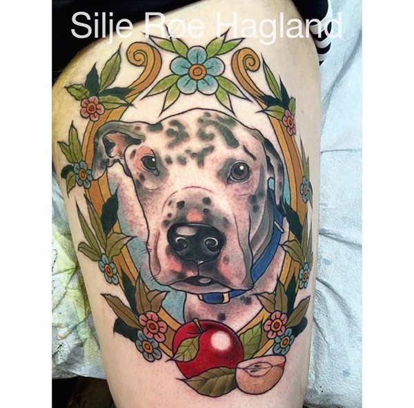 Beautiful painted and colored thigh tattoo of dog with flowers and apple