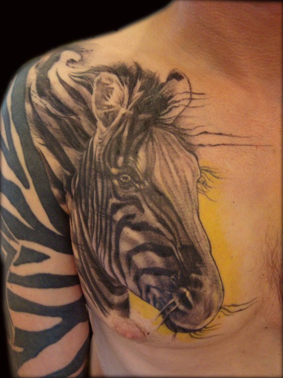 Beautiful painted big black and white zebra tattoo on chest