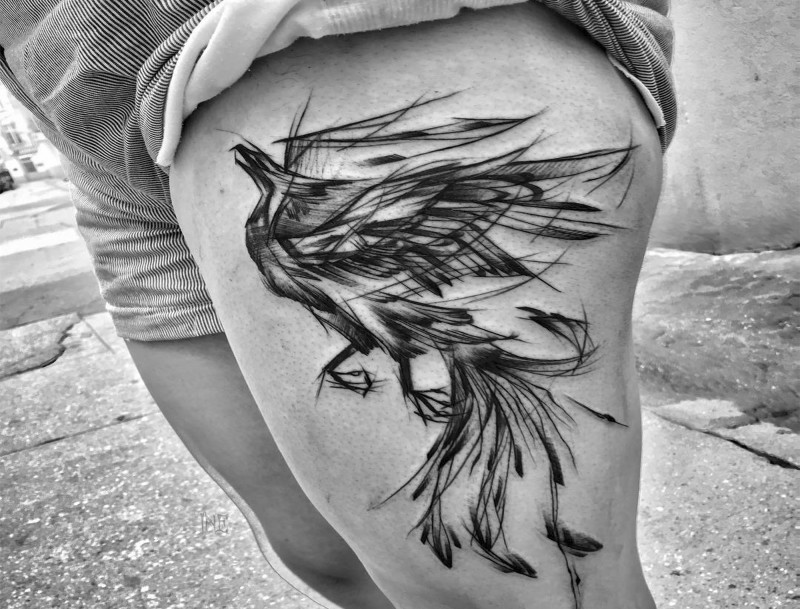 Beautiful painted black ink thigh tattoo of phoenix bird by Inez Janiak
