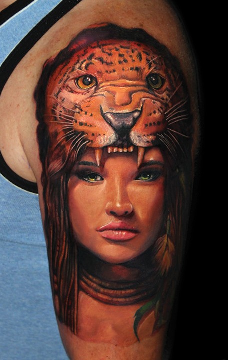 Beautiful painted natural looking shoulder tattoo of woman with leopard helmet