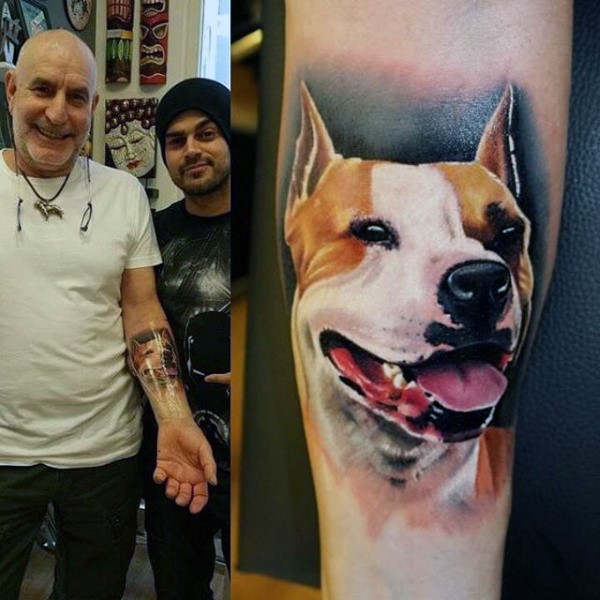 Beautiful painted very realistic dog portrait tattoo on arm
