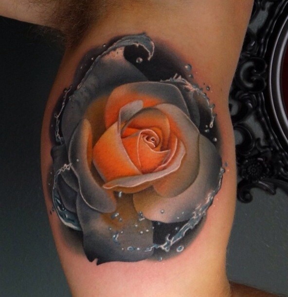 Beautiful realism style colored biceps tattoo of rose flower