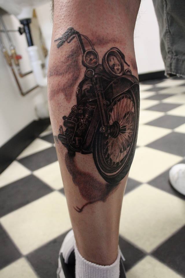 Beautiful realistic biker tattoo on leg