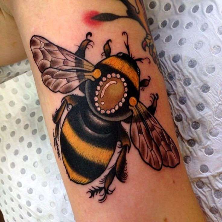 Beautiful realistic bumble bee tattoo on arm