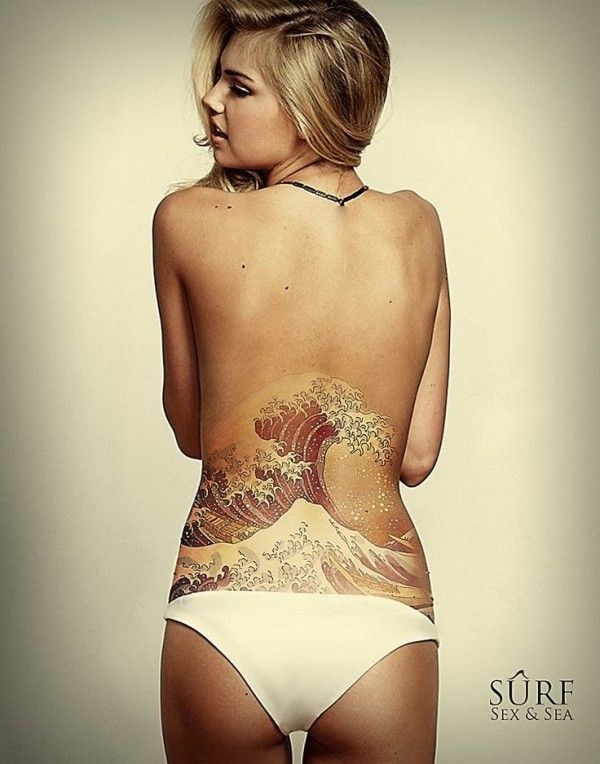 Beautiful realistic painted and colored massive ocean waves tattoo on waist