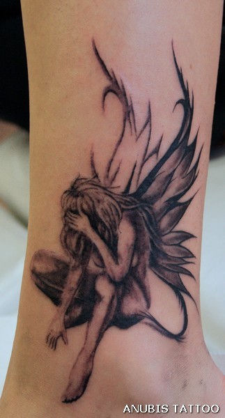 Beautiful sad fairy tattoo