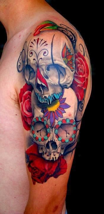 Beautiful sugar skulls with red roses tattoo