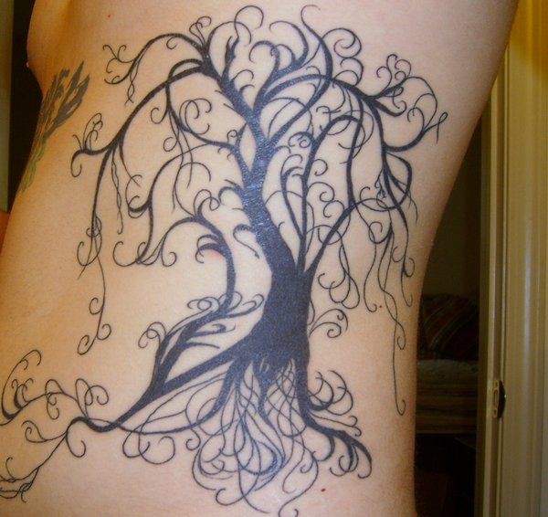 Beautiful tree patterns tattoo on ribs