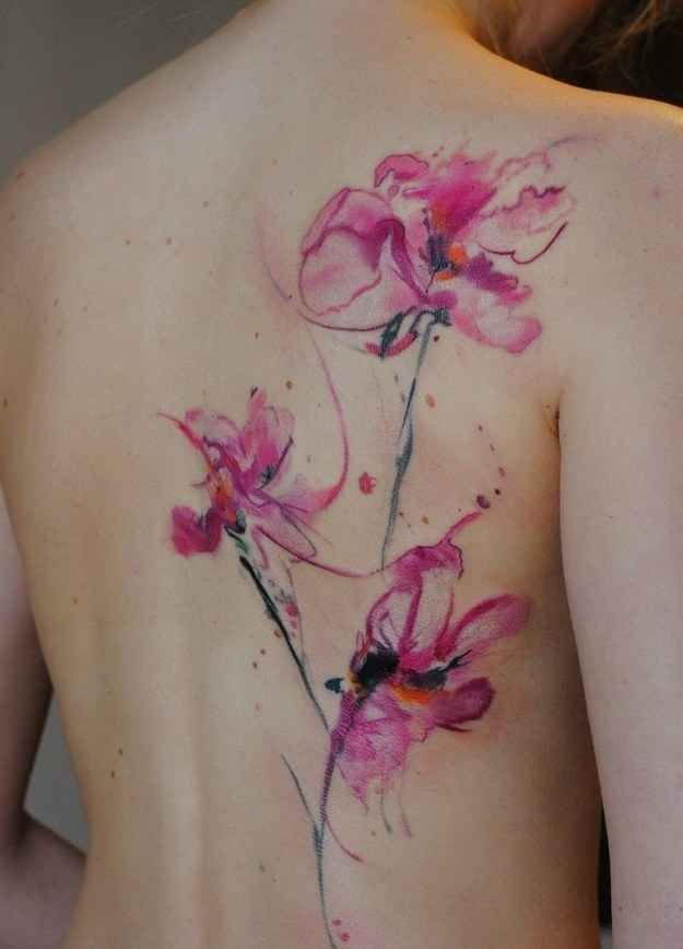 Beautiful watercolor flowers tattoo on back