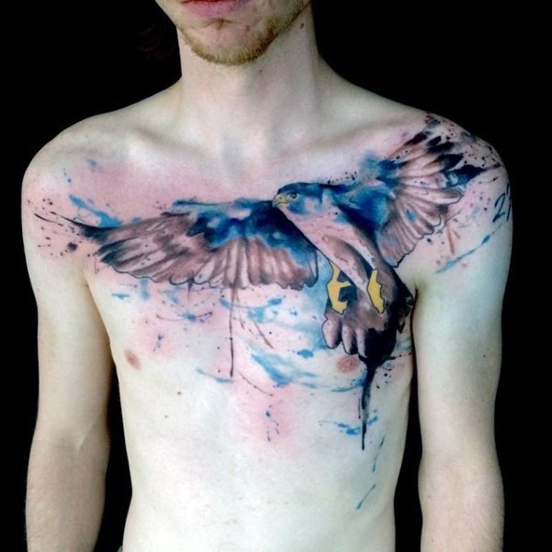 Beautiful watercolor style painted big eagle tattoo on chest