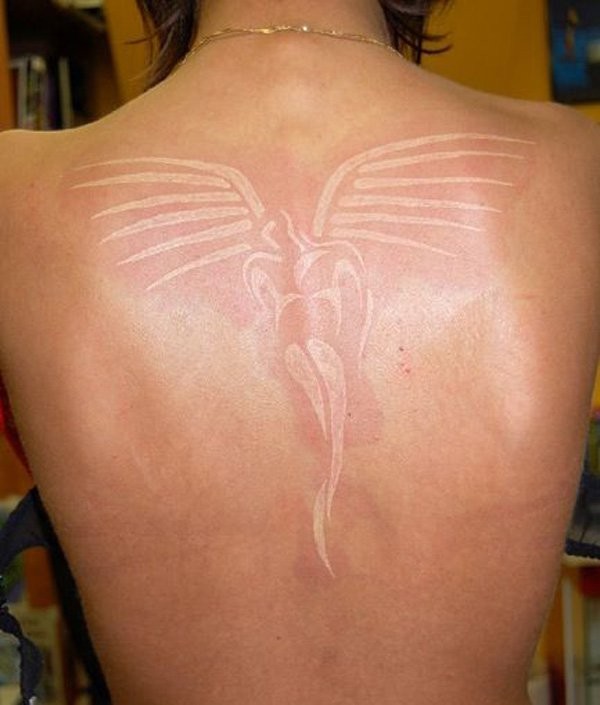 Beautiful white ink angel tattoo on back