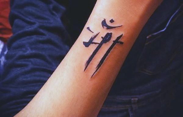 Big 3D like black ink Asian symbol tattoo on arm