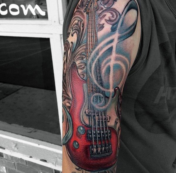 Big 3D like colored bass guitar tattoo on half sleeve area