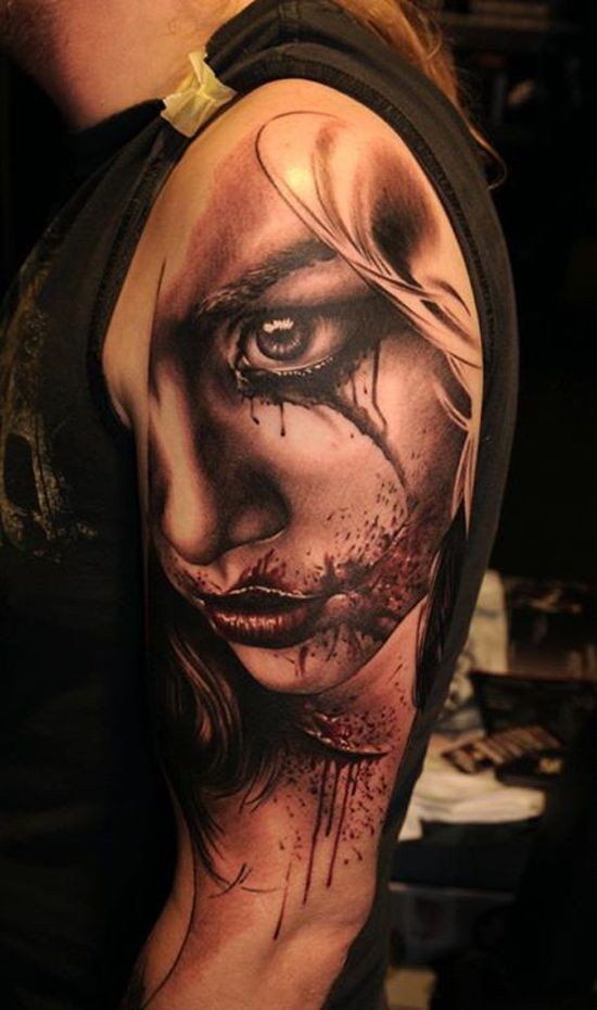 Big 3D like colored bloody woman portrait tattoo on upper arm