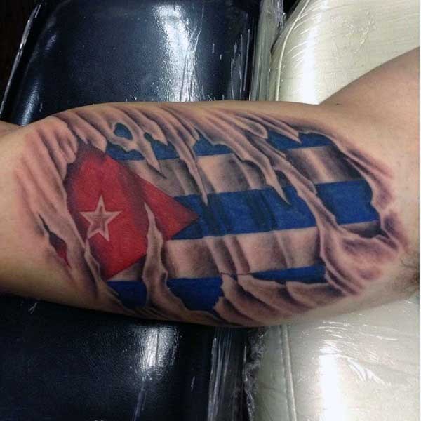 Big 3D like ripped skin tattoo with national flag tattoo on biceps