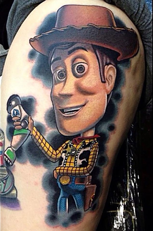 Big accurate colored toy story cartoon cowboy tattoo on thigh