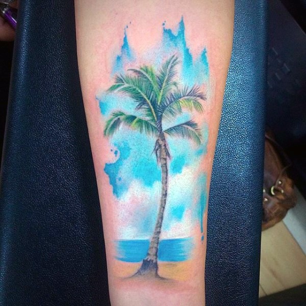 Big beautiful colored palm tree on ocean shore arm tattoo